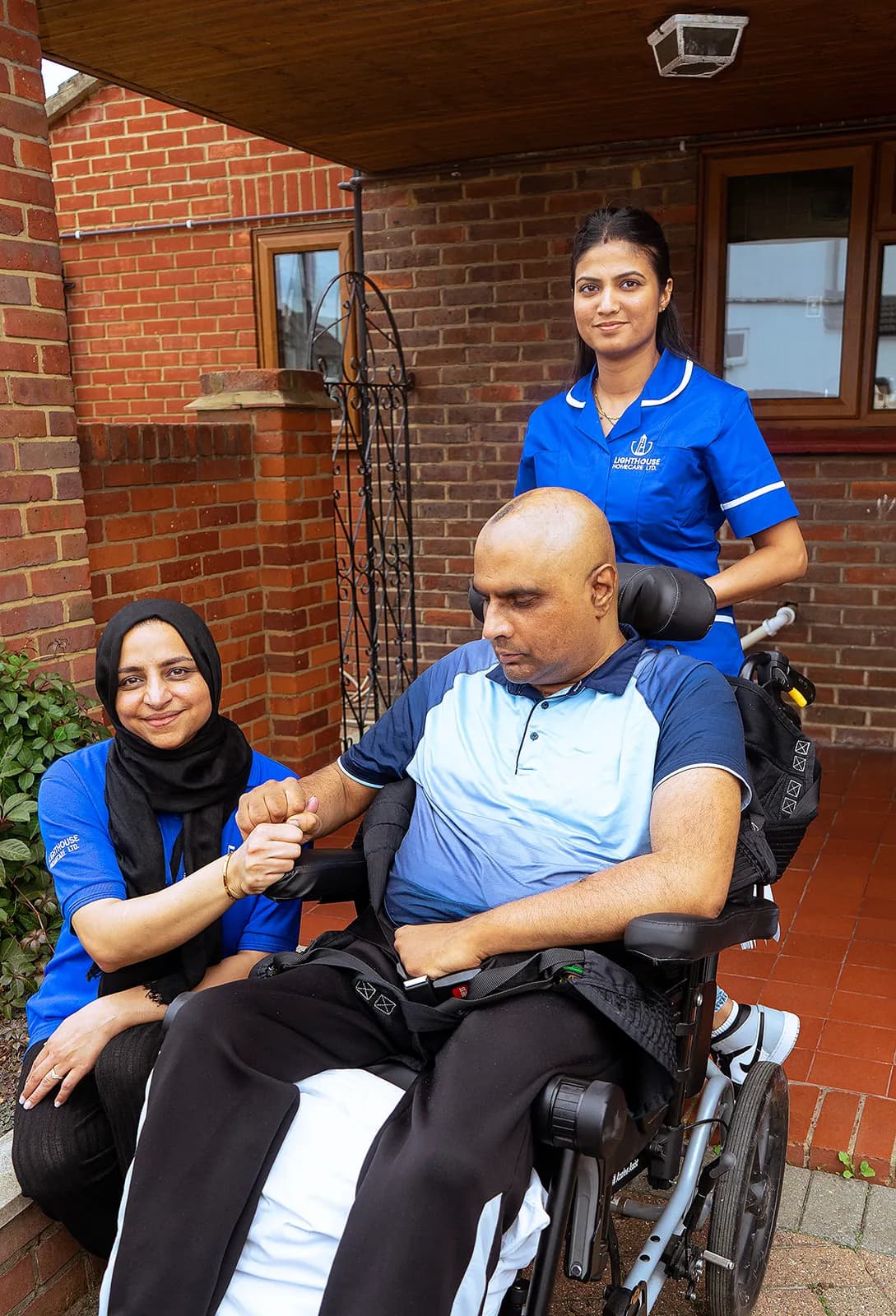 Caregiver reading with elderly patient